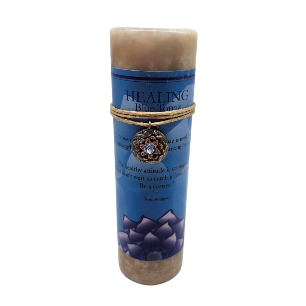 Healing Pillar Candle Featuring A Gold Lotus Design & Blue Topaz Stone Pendant